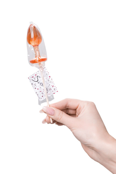 Оранжевый леденец в форме анальной пробки со вкусом амаретто - 29 гр.