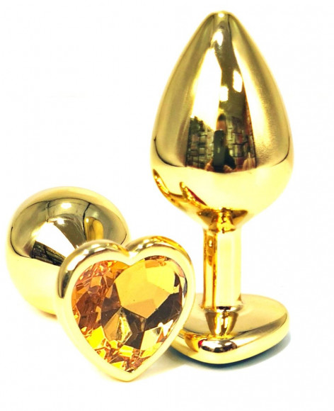 Золотистая анальная пробка с оранжевым кристаллом-сердцем - 6 см. Золотистая анальная пробка с оранжевым кристаллом-сердцем - 6 см.