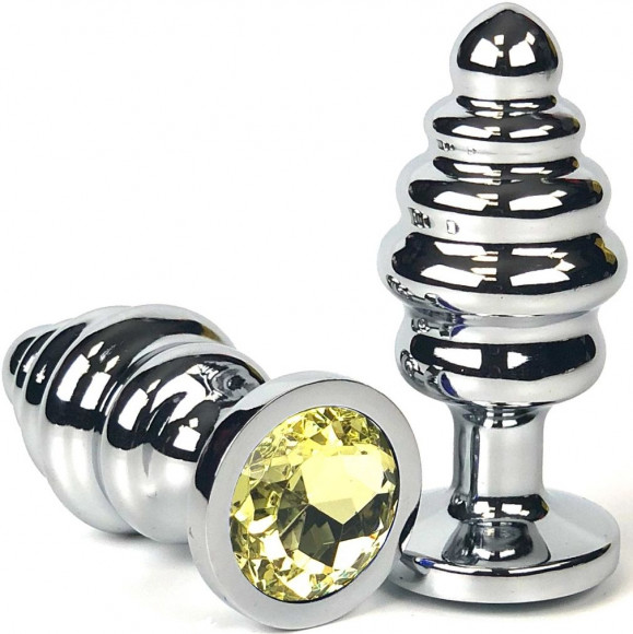 Серебристая ребристая анальная пробка с желтым кристаллом - 6 см. Серебристая ребристая анальная пробка с желтым кристаллом - 6 см.