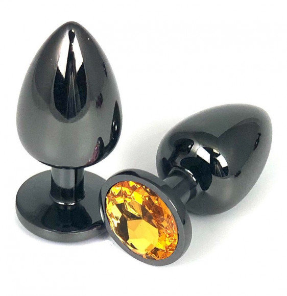 Черная металлическая анальная пробка с оранжевым стразом - 9 см. Черная металлическая анальная пробка с оранжевым стразом - 9 см.