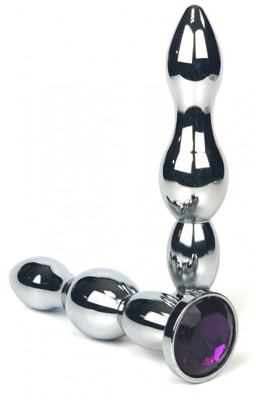 Серебристая коническая анальная пробка-ёлочка с фиолетовым кристаллом - 12 см. Серебристая коническая анальная пробка-ёлочка с фиолетовым кристаллом - 12 см.