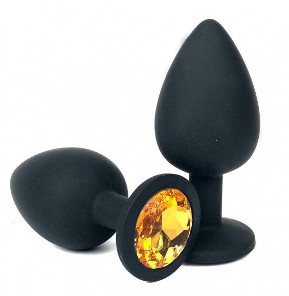 Черная силиконовая анальная пробка с оранжевым стразом - 6,8 см. Черная силиконовая анальная пробка с оранжевым стразом - 6,8 см.